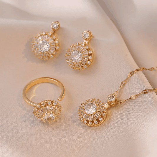 Parure feuille dorée avec collier, boucles d’oreilles et bague dorés ornés de cristaux ronds