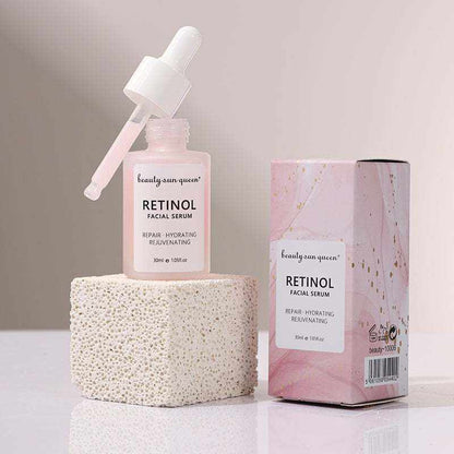 Sérum visage au rétinol rose en flacon pipette, avec boîte assortie et étiquette Retinol Facial Serum